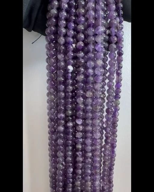 Amethyste perles 5.5-6.5mm sur fil 40cm